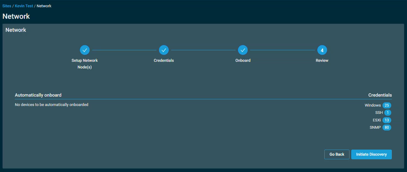 The Network setup wizard on the Review step, showing no devices to be automatically onboarded, and listing 25 Windows credentials, 1 SSH credential, 13 ESXI credentials, and 80 SNMP credentials. There is an "Initiate Discovery" button in the lower right, next to the Go Back button.